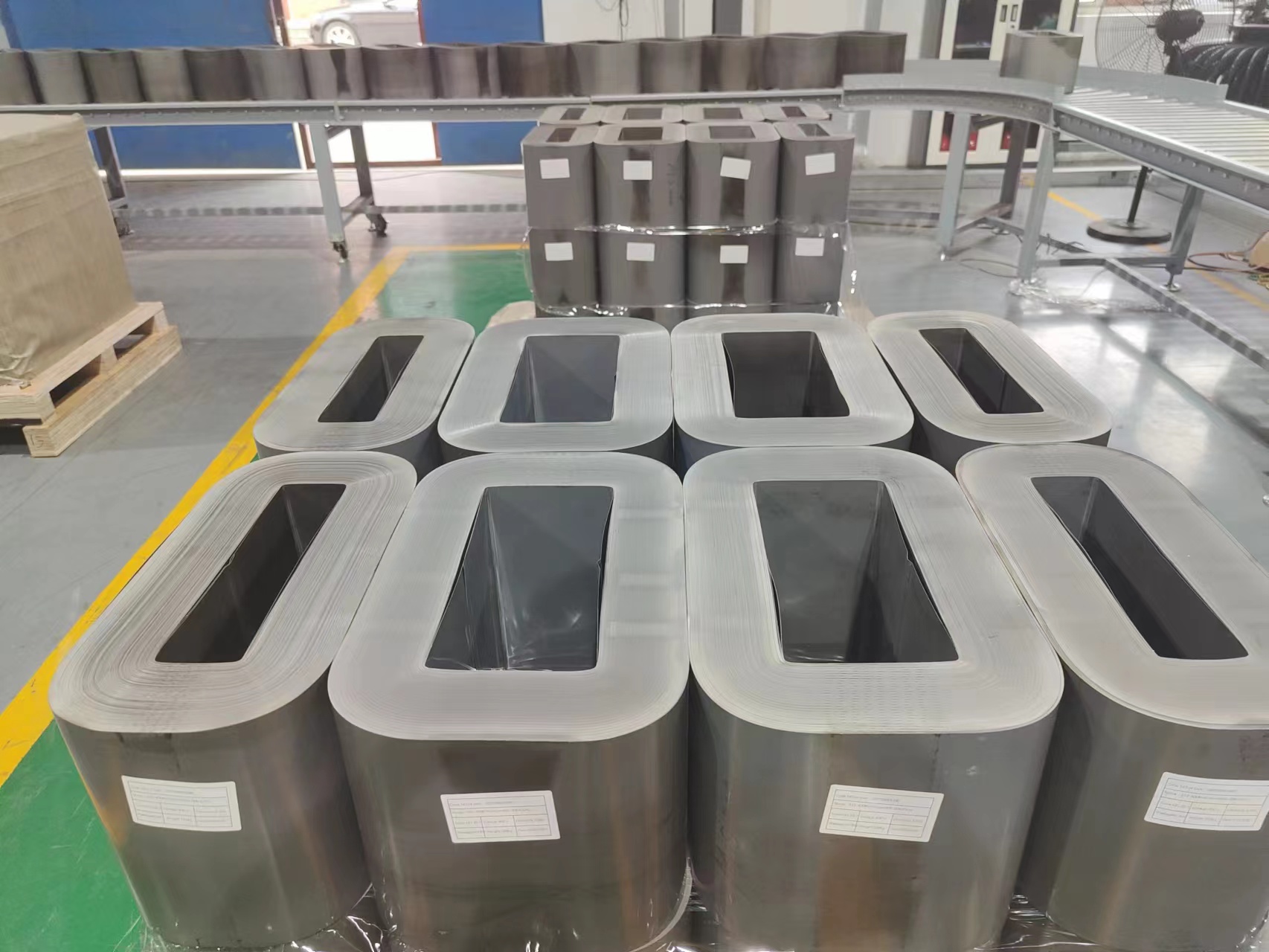 Rectangular wound CRGO transformer cores arranged in the production area
