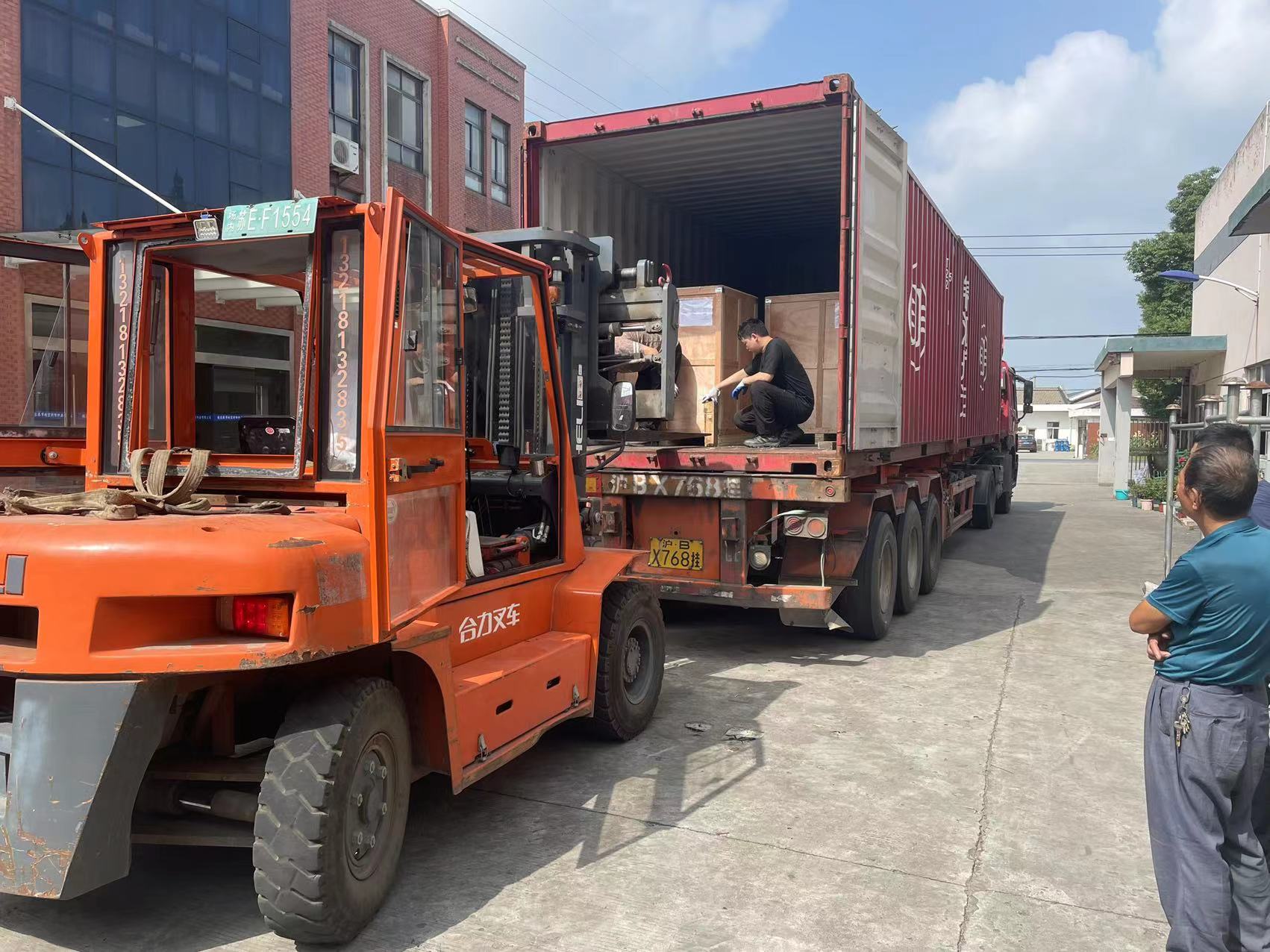 Wooden transformer core cases being positioned inside the container